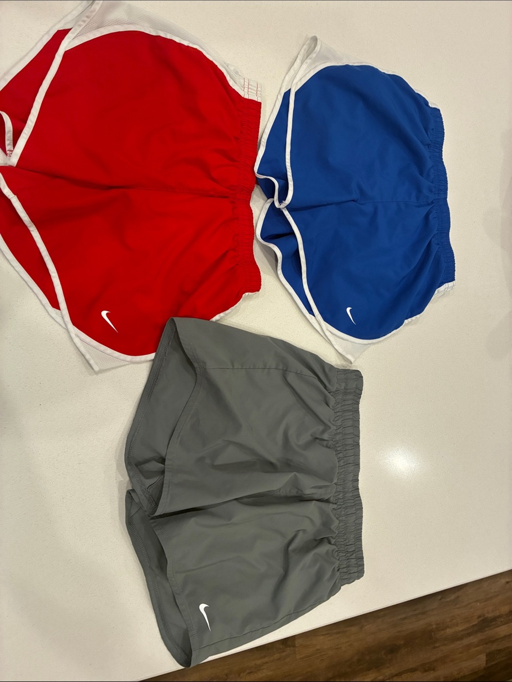 Nike Kids' Shorts Trio - Red, Blue & Gray. All size large. Excellent condition